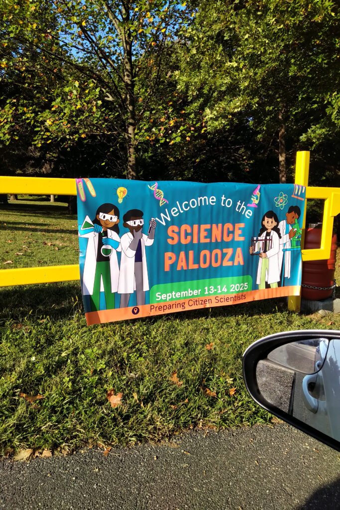 Outdoor banner welcoming visitors to Science Palooza event.