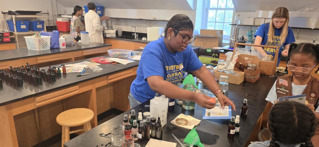 Student working on a science experiment in a classroom.